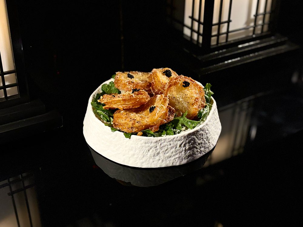 Gamjajeon — crisp Korean potato pancakes topped with caviar over arugula